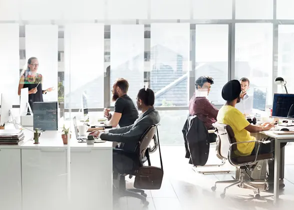 Team working together in a bright open office